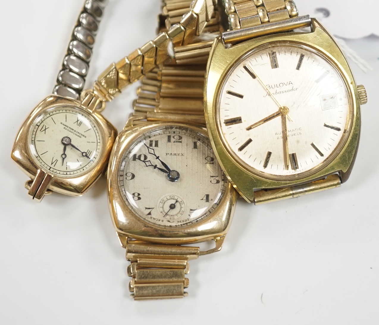 A gentleman's 1930's? yellow metal manual wind Parex wrist watch, on a gold plated bracelet, a lady's 9ct gold manual wind wrist watch, on a steel and gold plated strap and a gentleman's steel and gold plated Bulova Amba